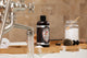 Packer's Pine Body Wash on a bathtub tray.